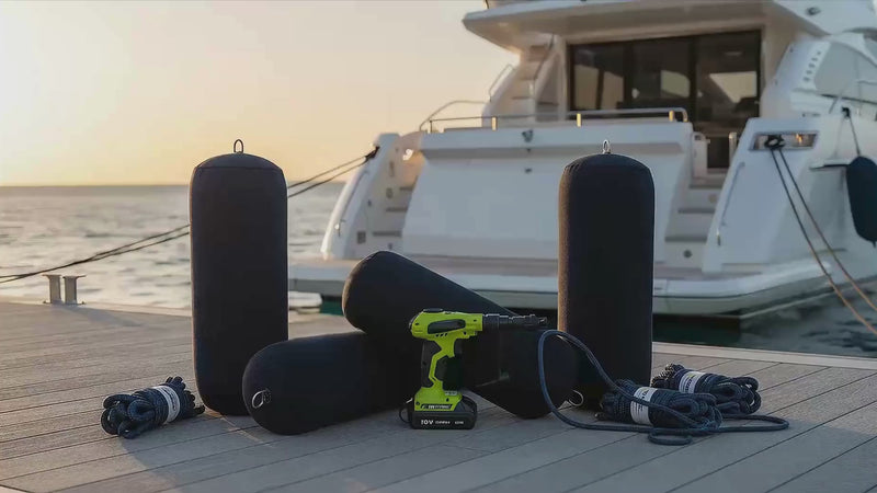 Complete 12-inch inflatable yacht fender protection system with 4 navy blue fenders and neoprene covers, 4 marine-grade fender lines, and 18V lithium battery inflator on modern dock with luxury motor yacht at golden hour marina, professional docking equipment for premium vessels 45-65 feet.