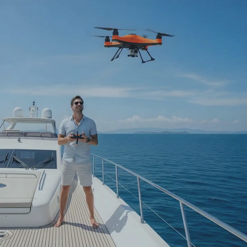 Man piloting the Fisherman FD1+ Waterproof Drone from a yacht – Yacht Protection Concepts